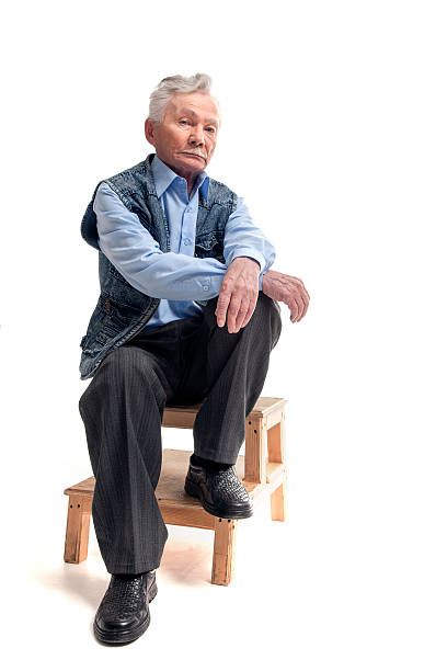 istock Man in a hat sitting with a gun 500198107