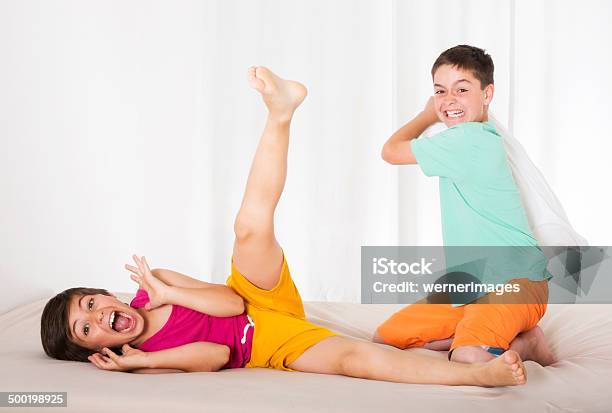 Pillow Fight Stock Photo - Download Image Now - Activity, Bed - Furniture, Bedroom
