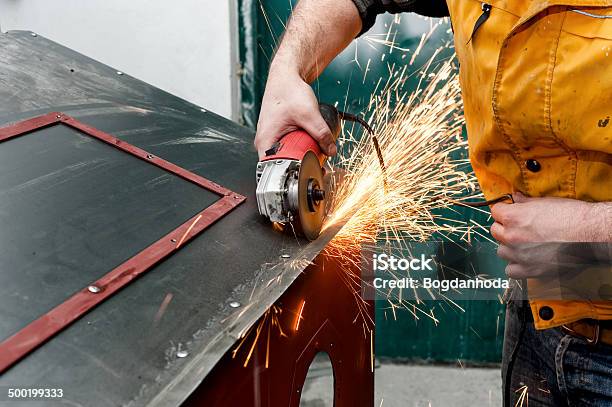 Industrial Worker Cutting Metal And Grinding Steel With Tools Stock Photo - Download Image Now