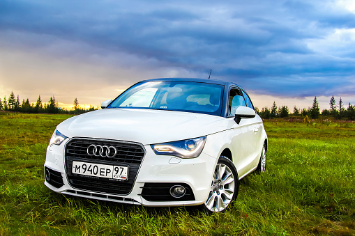 Novyy Urengoy, Russia - August 21, 2015: White motor car Audi A1 is parked at the countryside.