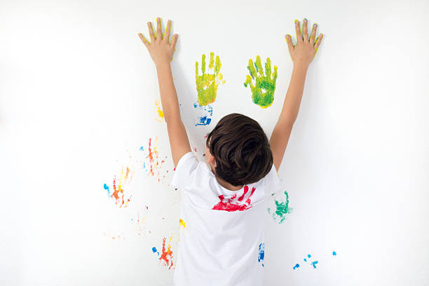 istock Boy Showing Colorful Paint on His Hands 500202366