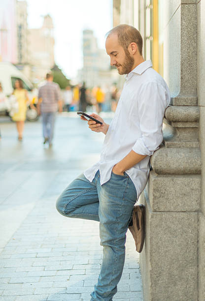 istock Man using phone in the street 500203202