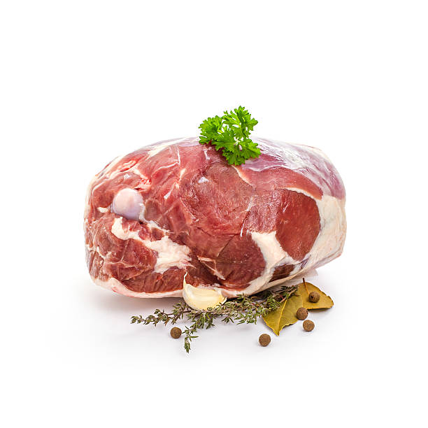 istock Raw lamb leg with bone, spices on white 500203276