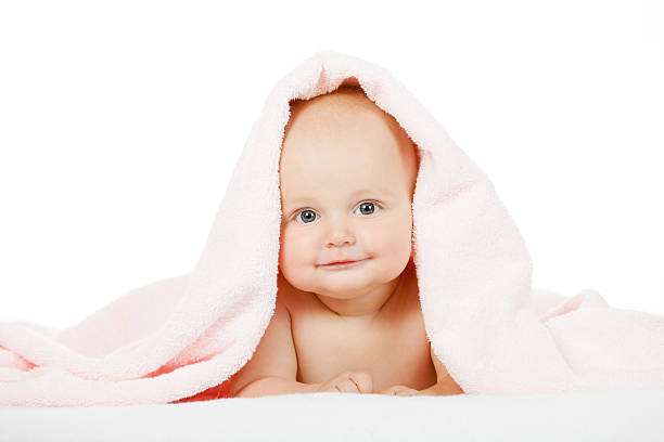 istock Caucasian baby boy covered with pink towel 500203330