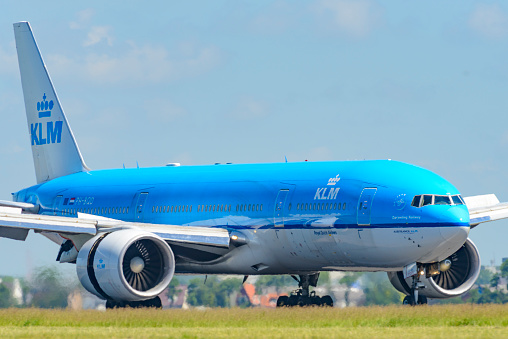 Schiphol, The Netherlands - June 11, 2014: KLM Boeing 777 airplane landing at Schiphol Airport near Amsterdam in The Netherlands.