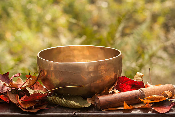 tibetan bowl singing bowl made of seven metals surrounded of colorful autumn leaves gong stock pictures, royalty-free photos & images