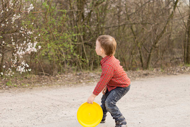 istock Little boy preparing to throw a frisbee 500210764