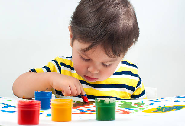 istock child draws ink on paper 500211386