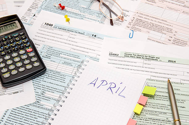 istock Tax forms with pen, calculator, glasses 500211740