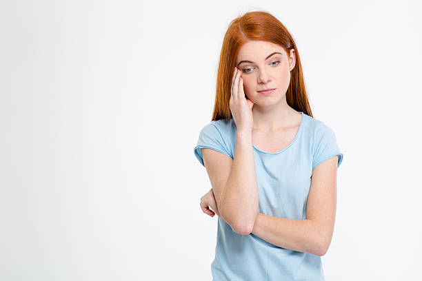 istock Sad depressed young female touching her temple and having headache 500211916