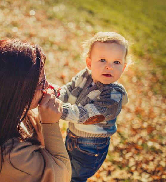 istock Mother with child in park 500212900