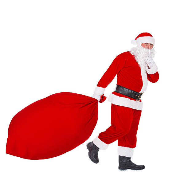 istock Santa Claus pull Christmas bag with gifts isolated on white 500212910