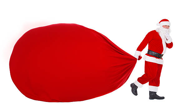 istock Santa Claus pull Christmas bag with gifts isolated on white 500213028