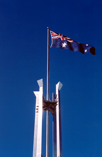 Canberra, ACT, Australia: New Parliament House - flagpole with Australian flag against blue sky - photo by M.Torres