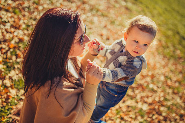 istock Mother with child in park 500214936
