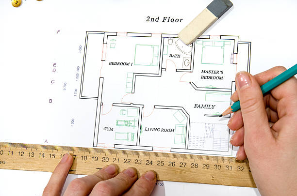 istock Hand of designer drawing the apartment, view from above 500214970