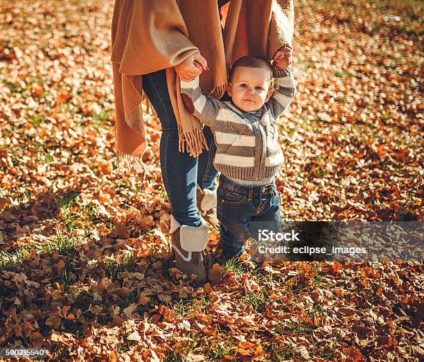 Mother With Child In Park Stock Photo - Download Image Now - 12-17 Months, 6-11 Months, Adult