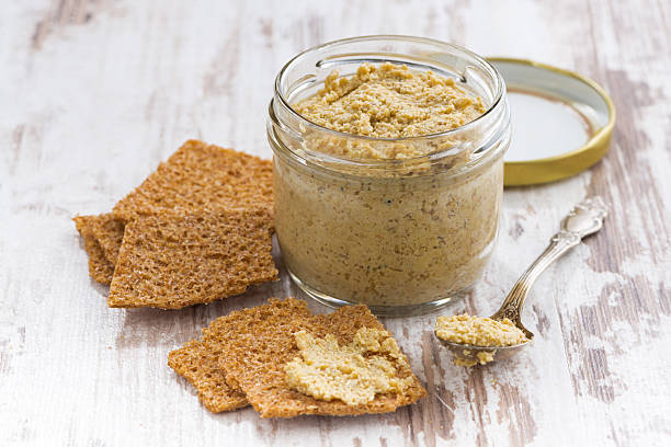 istock homemade mustard in a glass jar and crackers 500216882