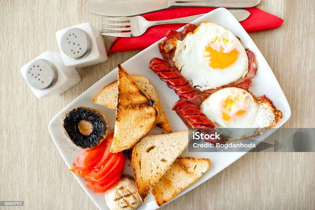 healthy breakfast with eggs, bacon, sausages, toast bread healthy breakfast with eggs, bacon, sausages, toast bread and mushrooms Bacon Stock Photo