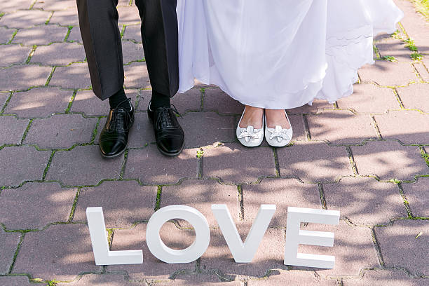 istock Feet of groom and bride 500217246
