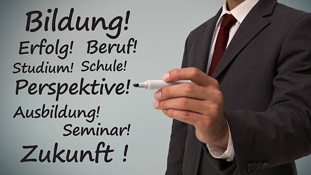 istock Businessman writing several words in german on careers 500217247