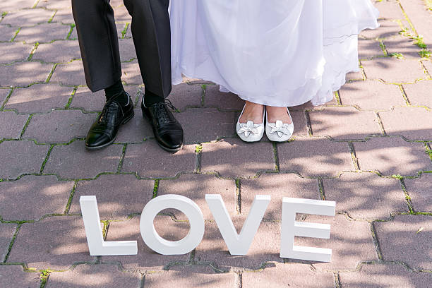 istock Feet of groom and bride 500217286