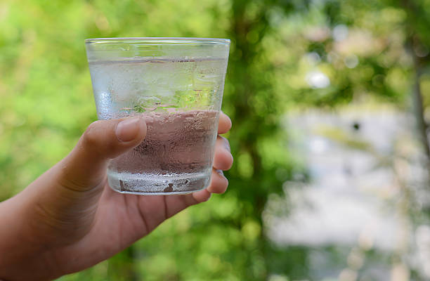 istock Glass water,Ice glass in hand. 500218366