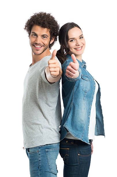 pareja joven mostrando pulgar arriba - confidence toothy smile thumbs up ok sign fotografías e imágenes de stock