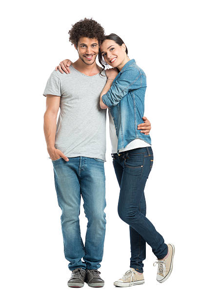 Loving Couple Standing Portrait Of Happy Young Loving Couple Looking At Camera Isolated On White Background arm around photos stock pictures, royalty-free photos & images