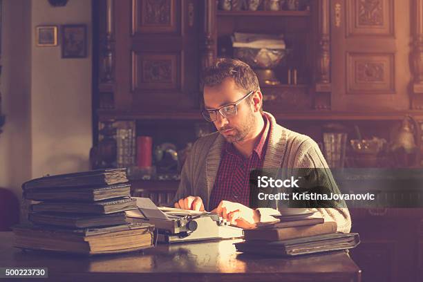 Young Man Writing On Old Typewriter Stock Photo - Download Image Now - Men, Typewriter, Only Men