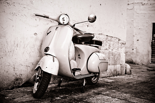 Gallipoli, Italy-August 21, 2015: old Vespa scooter parke in public road in Gallipoli, old town of south Italy.
