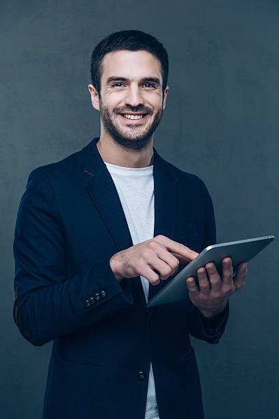 istock Enjoying his new digital tablet. 500225054