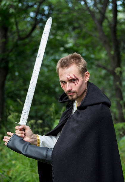 istock Portrait of a beautiful young warrior holding sword 500225652