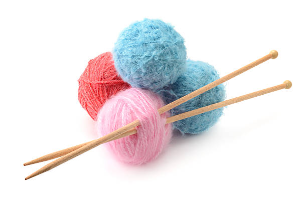 istock Woolen balls and knitting needles 500225818