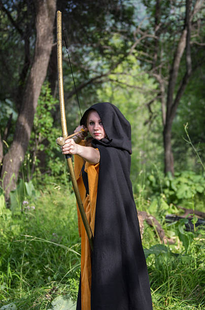 istock Beautiful woman drawing a bow 500226138
