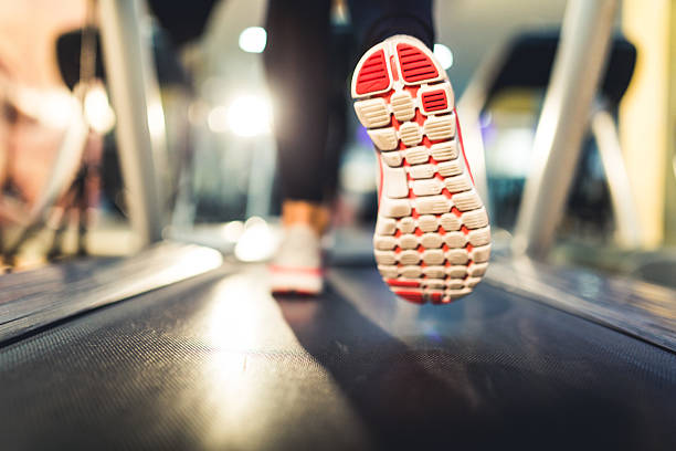 istock Close-up of Athlete shoes while running on treadmill 500228064