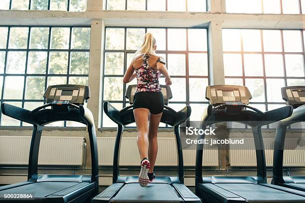 Woman Jogging On Treadmill Stock Photo - Download Image Now - Treadmill, One Woman Only, Women