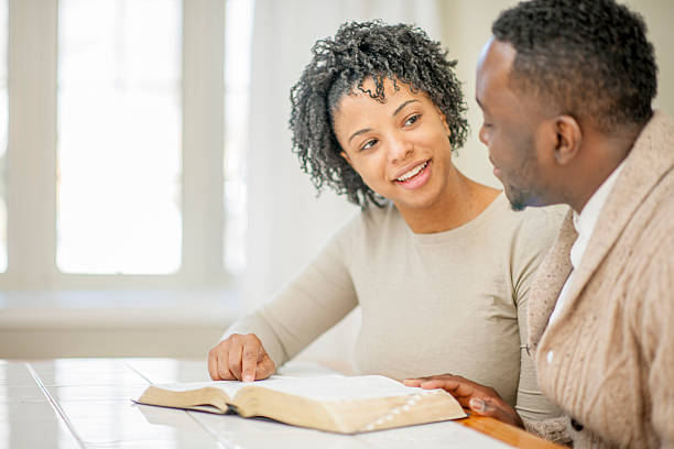 istock Husband and Wife Studying the Bible Together 500229374