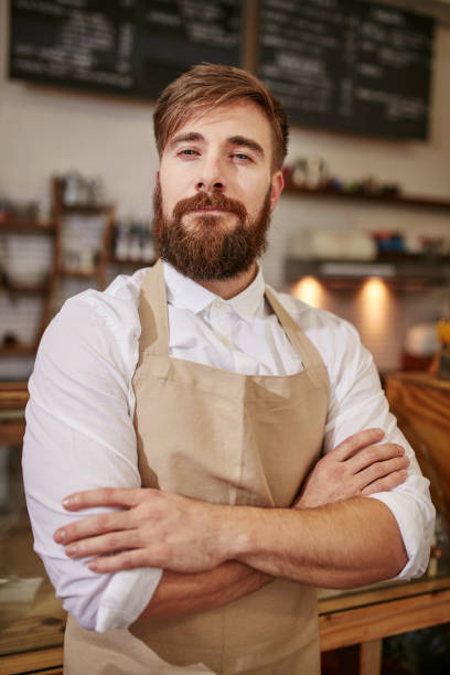 istock Proud barista standing in a coffee shop 500229846