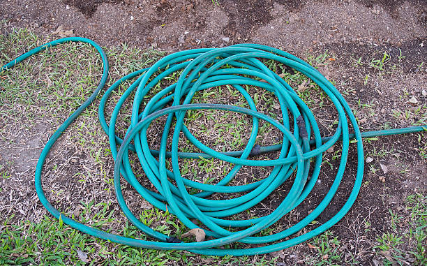 istock Green Garden Hose put a circles 500231414
