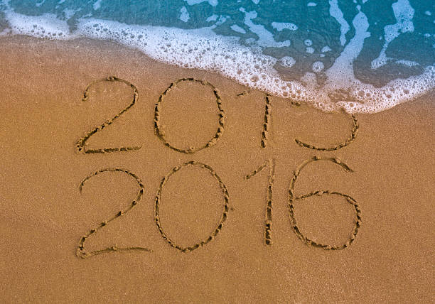 istock Happy New Year 2016 replace 2015 concept on sea beach 500232048
