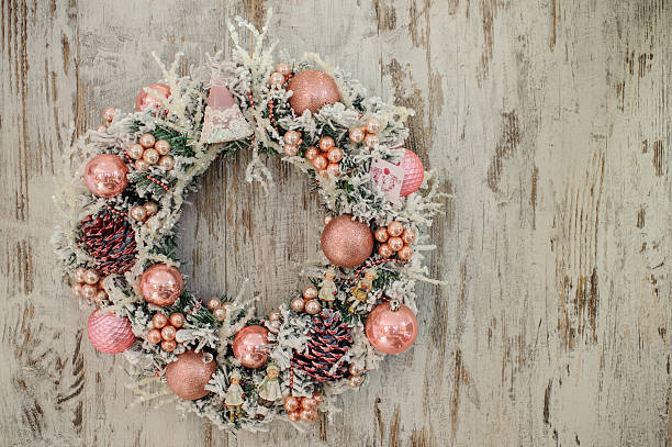 istock christmas wreath with pink decor and bubbles 500232142