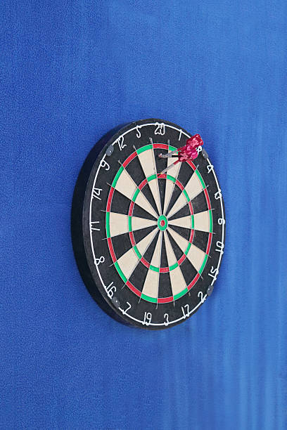 istock Dartboard with numbers and with javelins on wall 500232900