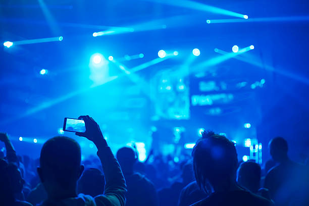 istock taking pictures  during a music concert 500233100