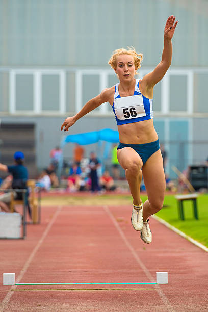 istock Young Female Athlete at Long Jump Competition 500233931