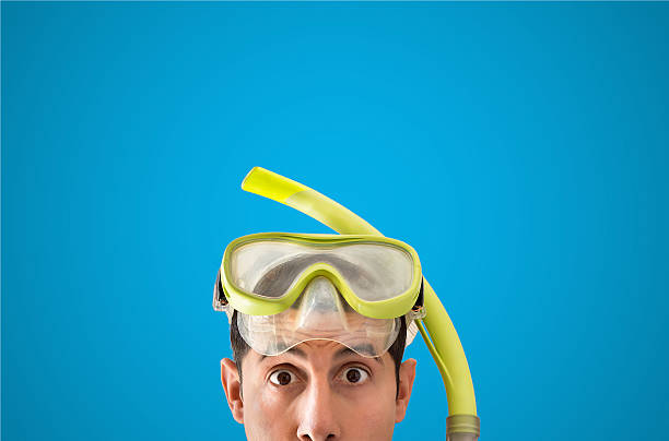 tourist with snorkel mask looks surprised