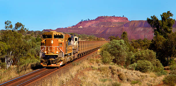 Loaded Ore Loaded Ore train leaving Mt Whaleback mine site, Newman Western Australia western australia stock pictures, royalty-free photos & images