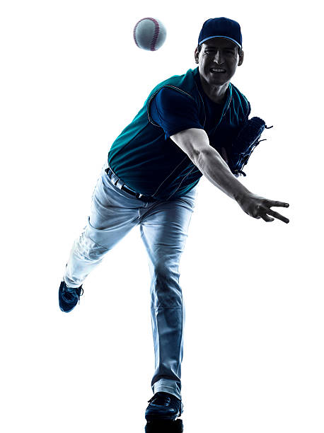 man baseball player silhouette isolated one caucasian man baseball player playing  in studio  silhouette isolated on white background baseball pitcher stock pictures, royalty-free photos & images