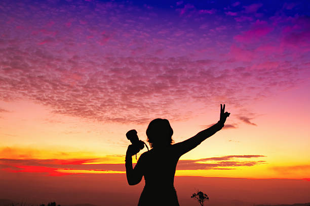 istock Photographer holding  camera at the sunset , silhouette shot 500235897