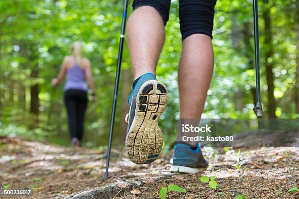 Young Couple Hiking In Nature Sport And Exercise Stock Photo - Download Image Now - Nordic Walking, Forest, Females